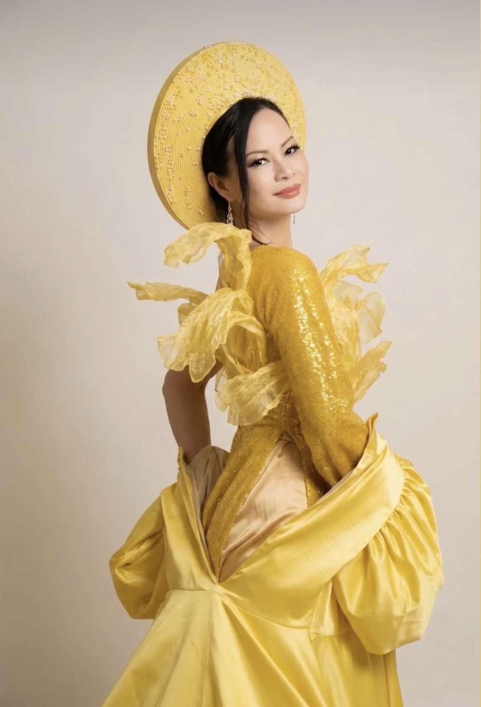 Kim Delevett in yellow áo dài